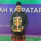 Teks foto : Ketua Pokdarwis Desa Pela, Alimin